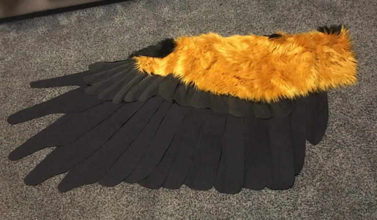 Arm-actuated oracle costume wing